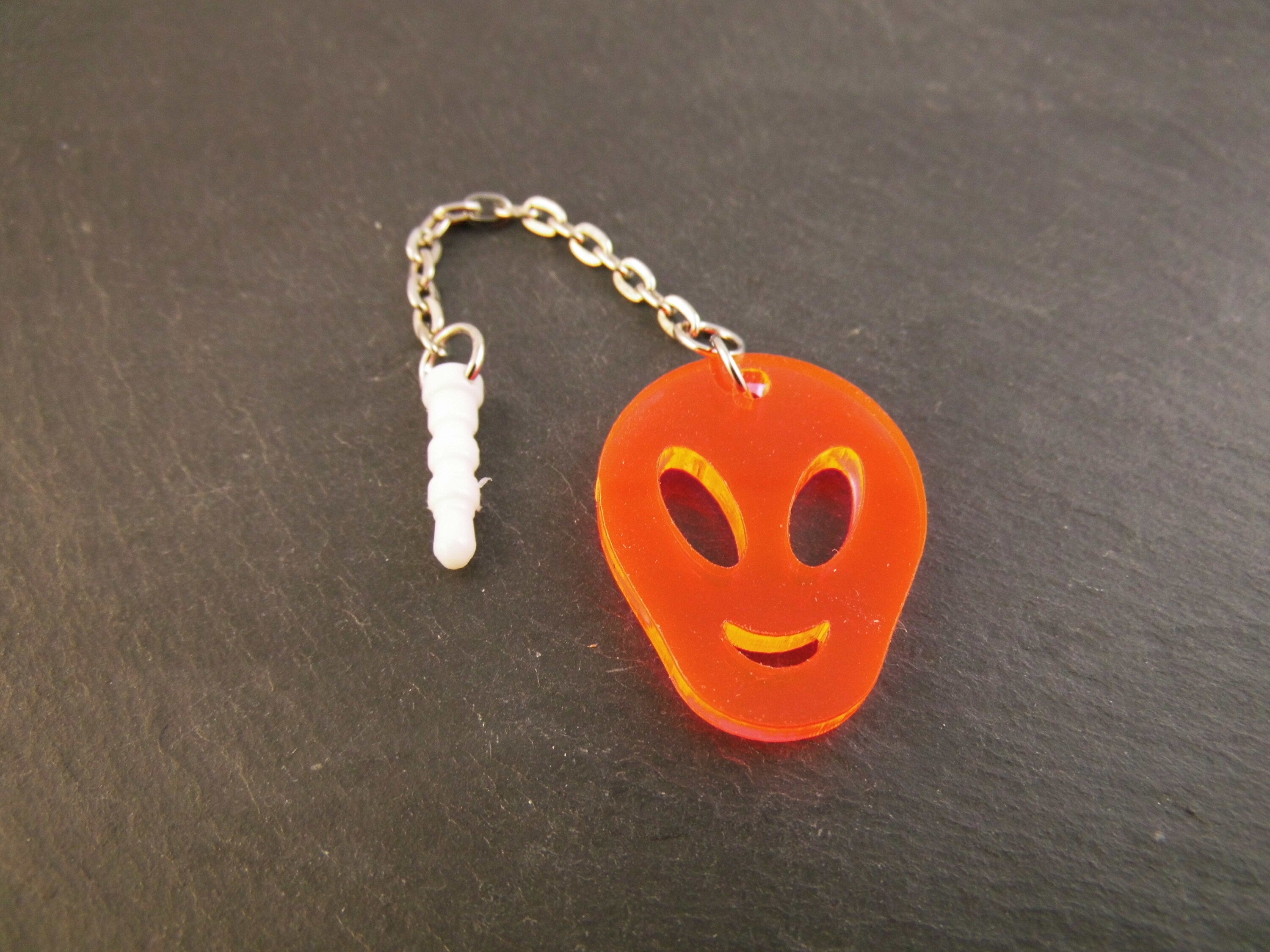 Handyanhänger Alien orange fluoreszierend Acryl Handyschmuck Staubschutz